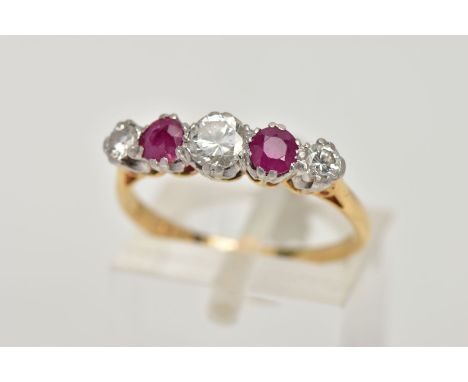 A YELLOW METAL RUBY AND DIAMOND FIVE STONE RING, designed with three round brilliant cut diamonds, total estimated diamond we