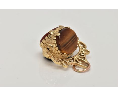 A 9CT GOLD SWIVEL FOB PENDANT, set with tiger eye, onyx and carnelian, within an openwork scroll detailed mount, hallmarked 9