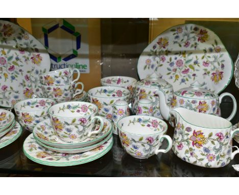 A MINTON HADDON HALL PATTERN TEA SET, comprising two bread and butter plates, salt and pepper pots, pepper has tiny chips to 