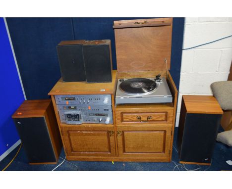 A VINTAGE ROTEL COMPONANT HI FI in an oak cabinet comprising of a RP 510 turntable (works as should), a RA 560 Amplifier (wor