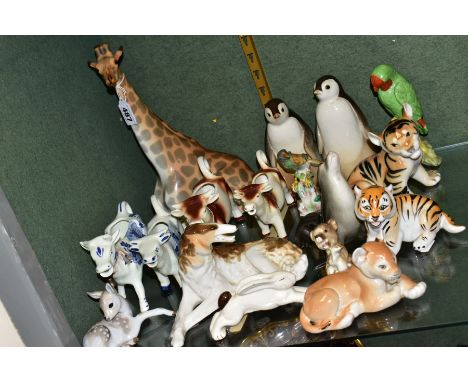 A GROUP OF ANIMAL/BIRD FIGURES, comprising USSR giraffe (seated), height approximately 30cm, two penguins, tallest 16cm , two