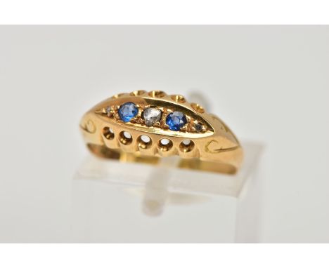 AN EARLY 20TH CENTURY, 18CT GOLD SAPPHIRE AND DIAMOND BOAT RING, the central piece set with two circular cut blue sapphires, 