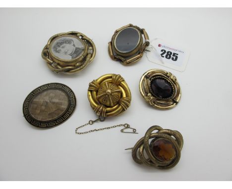 A Collection of Victorian Brooches, including mourning style brooch, the glazed oval panel encasing woven hair, within black 