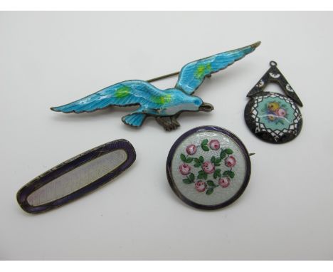 An Enamel Bird Brooch, highlighted in turquoise; together with an circular panel brooch, highlighted with roses, enamel penda