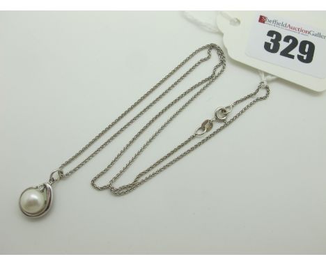 A Modern Pearl Pendant, on a fancy link fine chain stamped "750" (overall weight 4grams).