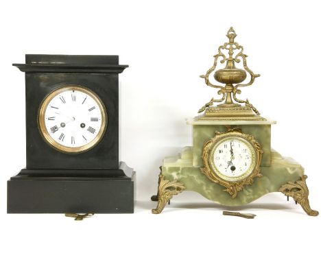 An onyx mantel clock, 40cm high, and a slate mantel clock, 33cm high