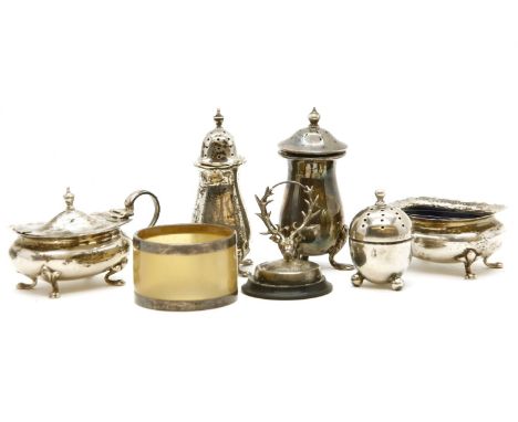 A collection of silver items, to include cruet sets, a menu holder and a horn napkin ring (Qty.)