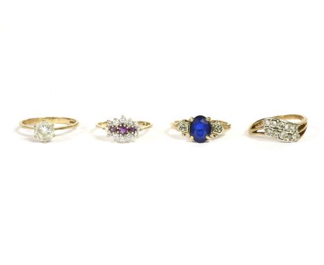 A gold single stone blue synthetic ring, oval cut to textured white shoulders and a plain polished shank, 2.33g, a 9ct gold s