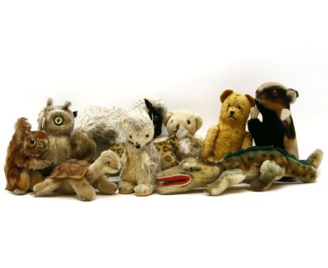 A collection of nine various mid 20th century Steiff animals, to include a gold bear, a leopard, a turtle, a hedgehog, a squi