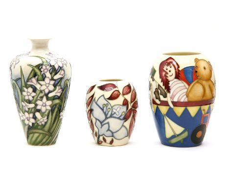 A Moorcroft 'Rag Doll Anna' vase, numbered 118/350, 13.5cm high, boxed, a 'Jacob's Ladder' vase, 9cm high, boxed, a 'Hyacinth