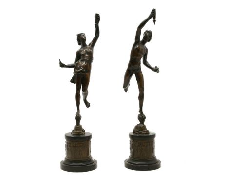 A pair of 19th century classical bronze figures, on cylindrical plinth bases, 43cm high