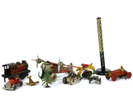 A collection of tin plate toys, a Farman F221 aeroplane, a search light, a tank, a safe, a new tractor, etc