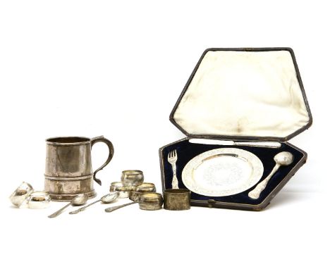 A collection of silver items, to include a Mappin &amp; Webb tankard, a cased christening set, various flatware and a set of 