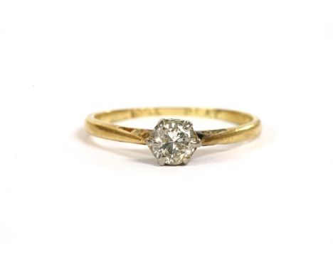 A gold single stone diamond ring, a brilliant cut diamond, claw set to chenier shoulders and a plain polished shank, marked 1