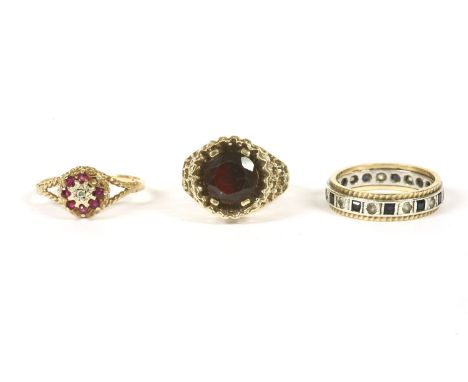 A 9ct gold single stone garnet ring, pierced head and plain polished shank, 3.42g, a 9ct gold two colour synthetic sapphire a