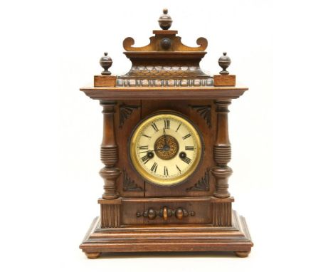 A late 19th to early 20th century German HAC walnut mantel clock, with fourteen day strike on a coiled gong, the case with pi
