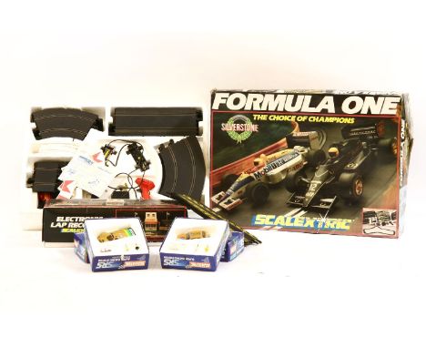 A collection of Scalextric cars and track, to include a Formula One set, 4 x SRS cars and an electronic recorder