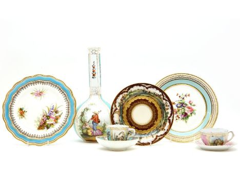 A collection of Dresden porcelain, to include a bottle vase, pierced bowl, saucers, cup and saucers, together with a pair of 