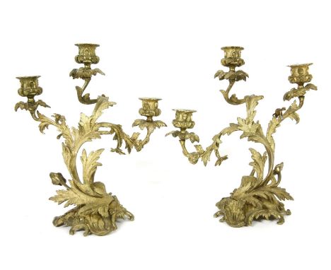 A pair of gilt bronze three branch candelabra, 33cm high