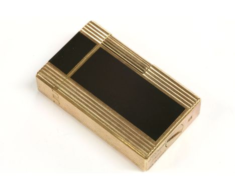 An S T Dupont gold plated lighter, set with Japanese black lacquer inlay, with printed oriental character marks