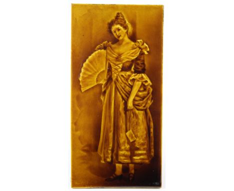 Sherwin & Cotton mustard yellow majolica glazed picture tile, circa late 19th to early 20th century, depicting a woman holdin