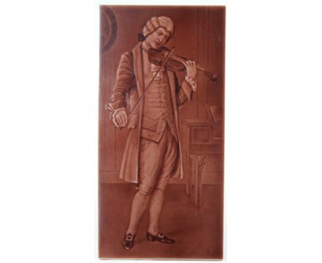 Sherwin & Cotton salmon majolica glazed picture tile, circa late 19th to early 20th century, depicting a gentleman playing a 