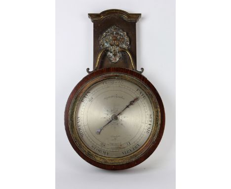 Negretti & Zambra compensated mahogany wall barometer, circa 19th century, with a brass Lion head above, silvered dial number