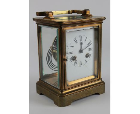 Goliath brass five glass chiming carriage clock, circa 19th century, white enamel dial with Roman numerals, key present, some