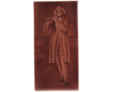 Sherwin & Cotton salmon majolica glazed picture tile, circa late 19th to early 20th century, depicting a gentleman playing a 