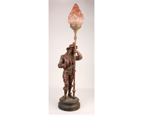 Lamp depicting a statue of Don Juan holding a torch with flame shaped glass dome, total height 79cm approx.