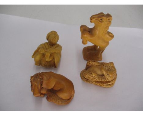 Four Carved Wood Netsuke 