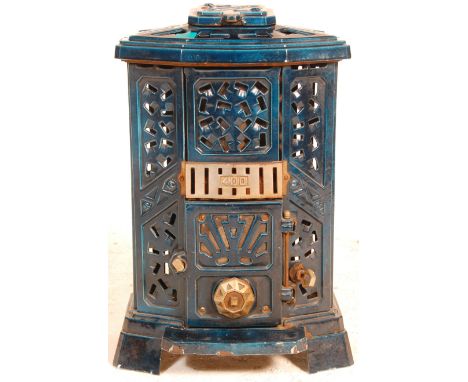 Godinette - An early 20th century French enamel wood burner stove finished in a blue enamel colourway with lattice and pierce