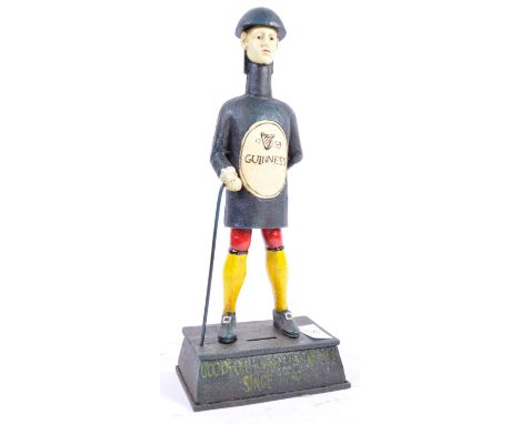 Guinness - Advertising - A vintage style cast and wrought iron hand painted advertising point of sale money bank figurine of 