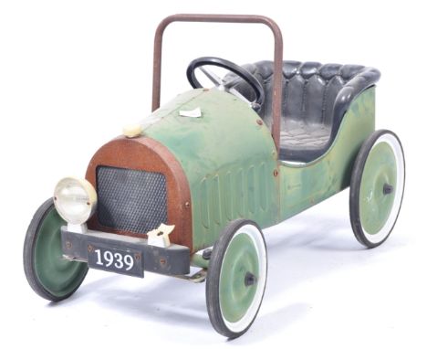 An original retro vintage pedal car, likely by Tri-ang, having been used as film / display prop (unknown production). The wel