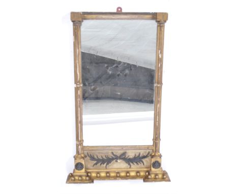 An antique 19th century gilt wood and gesso work pier mirror of rectangular tall form. The central mirror with Ionic type col