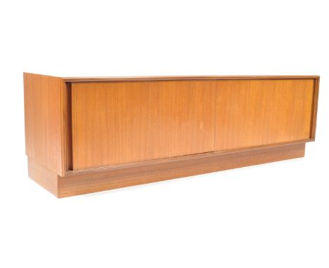 An original retro vintage 20th century teak wood low sideboard / credenza being raised on an inset plinth base with&nbsp; bli