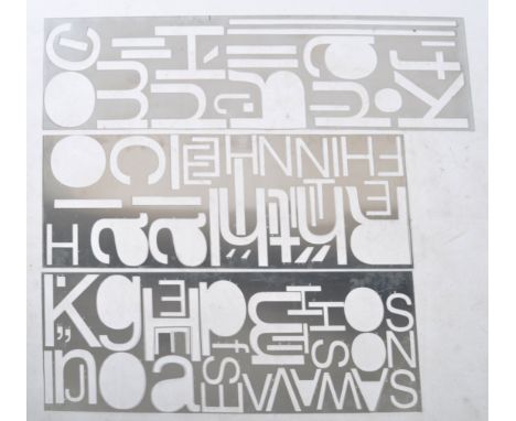 A pair of contemporary sheet metal panels having pierced letter typeface all over. These panels from modern letterpress desig