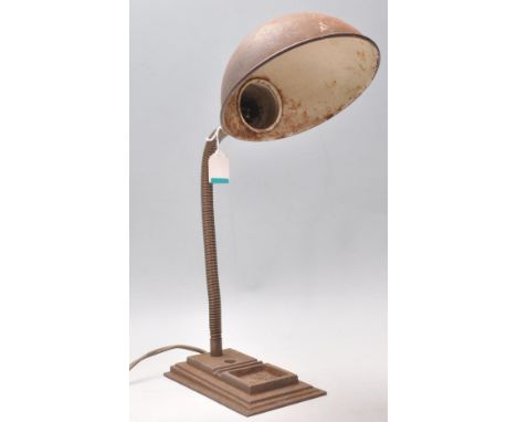 An antique 1920's / 1930's Art Deco industrial anglepoise desk lamp having a cast metal stepped rectangular base with a goose