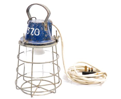 A mid century military issue cage lamp / Trouble Light. The blue cast metal mount with crows foot marking and SA390 model no 