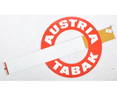 A 20th century retro continental enamel shop advertising sign for Austria Tabak. The sign in the form of a cigarette with red