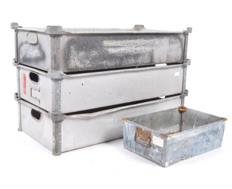 A stack of vintage industrial bakers / bread tote trays. Each of rectangular form stacking on top of each other with panel si