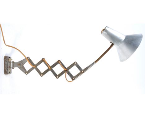 Christian Dell - Fritz Hansen (manner of) - A vintage 20th century industrial steel lamp being wall mounted attached to an ex