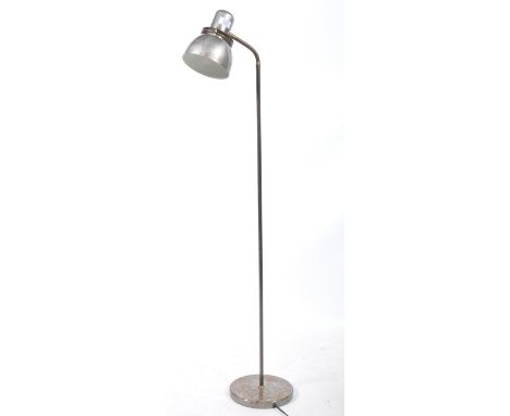 An early to mid 20th century ' machine age ' aluminium floor - standard lamp. Raised on terraced circular base with tall colu