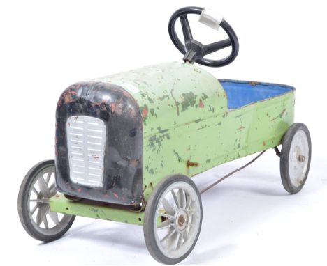 A vintage 1950's / 1960's&nbsp; pressed metal plate vintage racing car pedal car having been used as film / display prop (unk