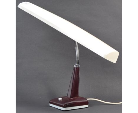 A retro 1970's plastic two tone colourway bankers desk lamp. The lamp in burgundy and white colourway with square base having