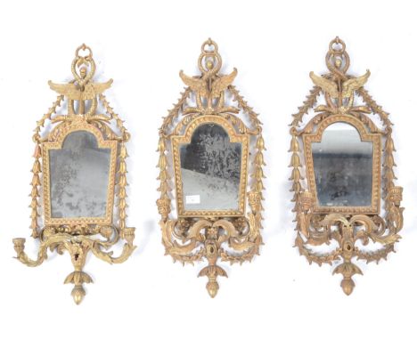 A set of three antique 19th century Italian giltwood Girandole Florentine wall mirrors. Each with twin sconces and shaped arm