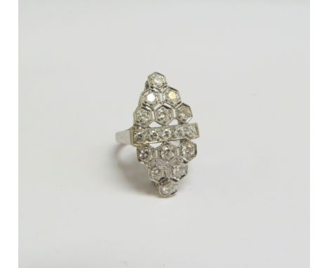 A platinum ring set with diamonds in milgrain honeycomb design, the centre with a row of diamonds. Size J, 6.7g 