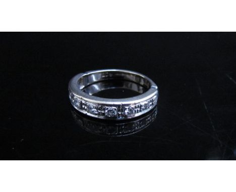 A white gold half hoop diamond ring, stamped 18ct. Size N, 4.5g 