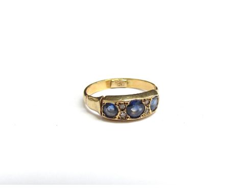 A 15ct gold sapphire and diamond ring. Size G/H, 1.9g 