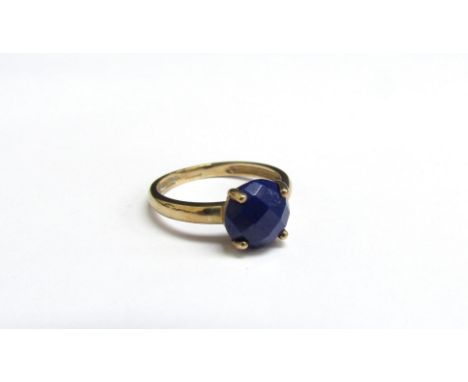 A 9ct gold ring with facetted lapis Lazuli. Size J, 1.5g 